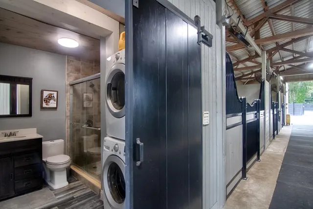 a view of a hallway with washer and dryer