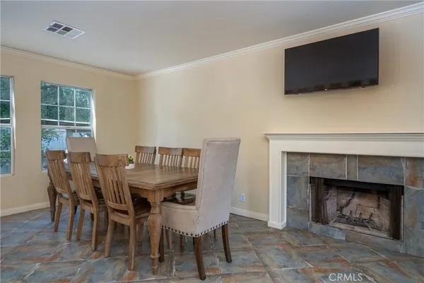 a view of a livingroom with furniture and a fireplace