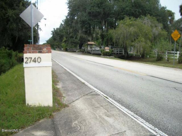 2740 Turtle Mound Road Melbourne, FL 32934 - Photo 13 of 16 a street sign on a sidewalk next to road