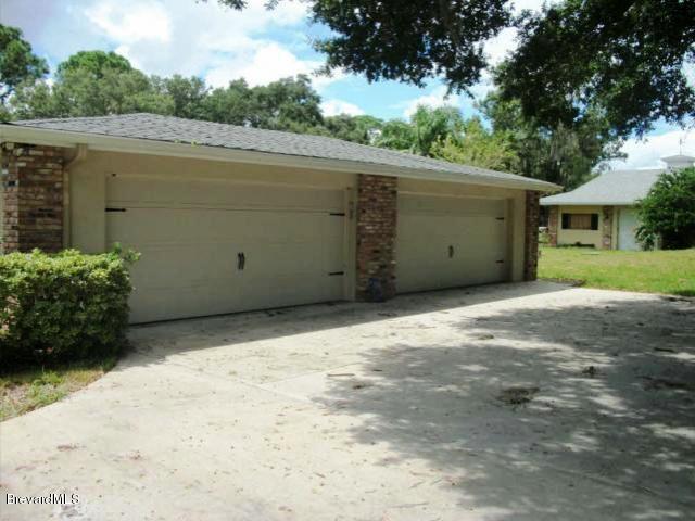 2740 Turtle Mound Road Melbourne, FL 32934 - Photo 14 of 16 a view of a garage