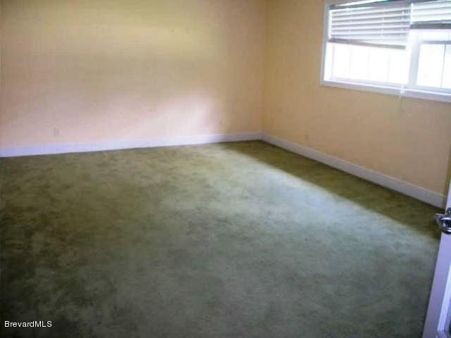 2740 Turtle Mound Road Melbourne, FL 32934 - Photo 5 of 16 an empty room with a window