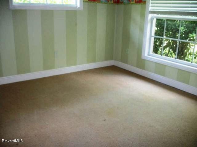 2740 Turtle Mound Road Melbourne, FL 32934 - Photo 7 of 16 a view of a room that has a window in it