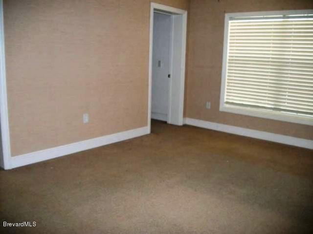 2740 Turtle Mound Road Melbourne, FL 32934 - Photo 8 of 16 an empty room with a window