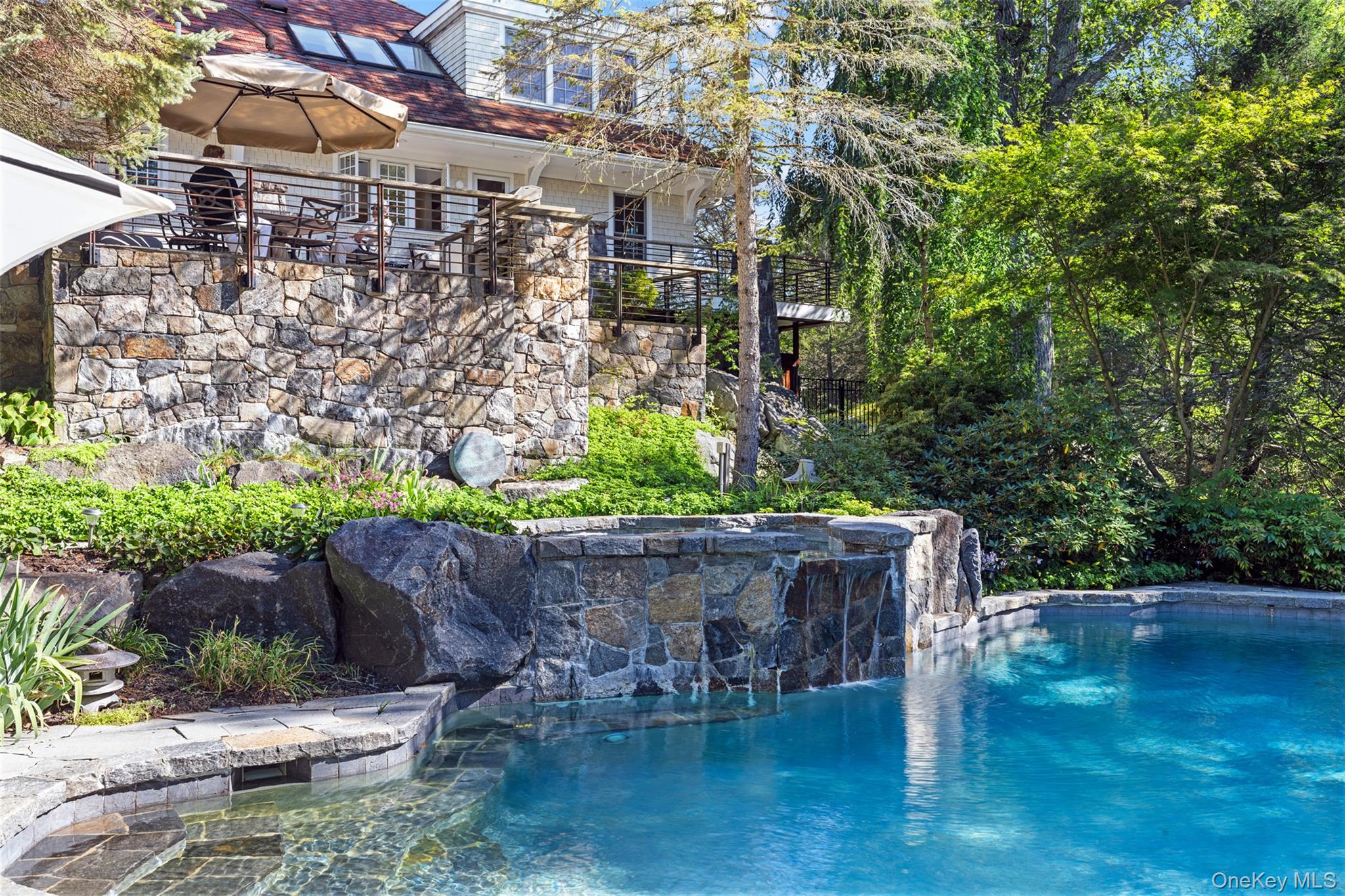 12 Bishop Park Road Pound Ridge, NY 10576 - Photo 1 of 49 a street view with sitting space and plants