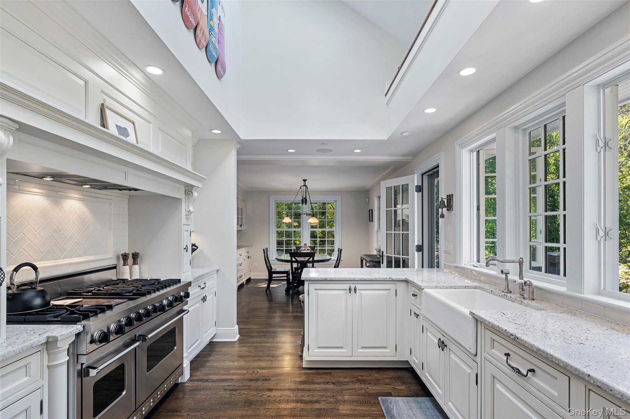 12 Bishop Park Road Pound Ridge, NY 10576 - Photo 13 of 49 a large white kitchen with stainless steel appliances granite countertop a stove and a sink