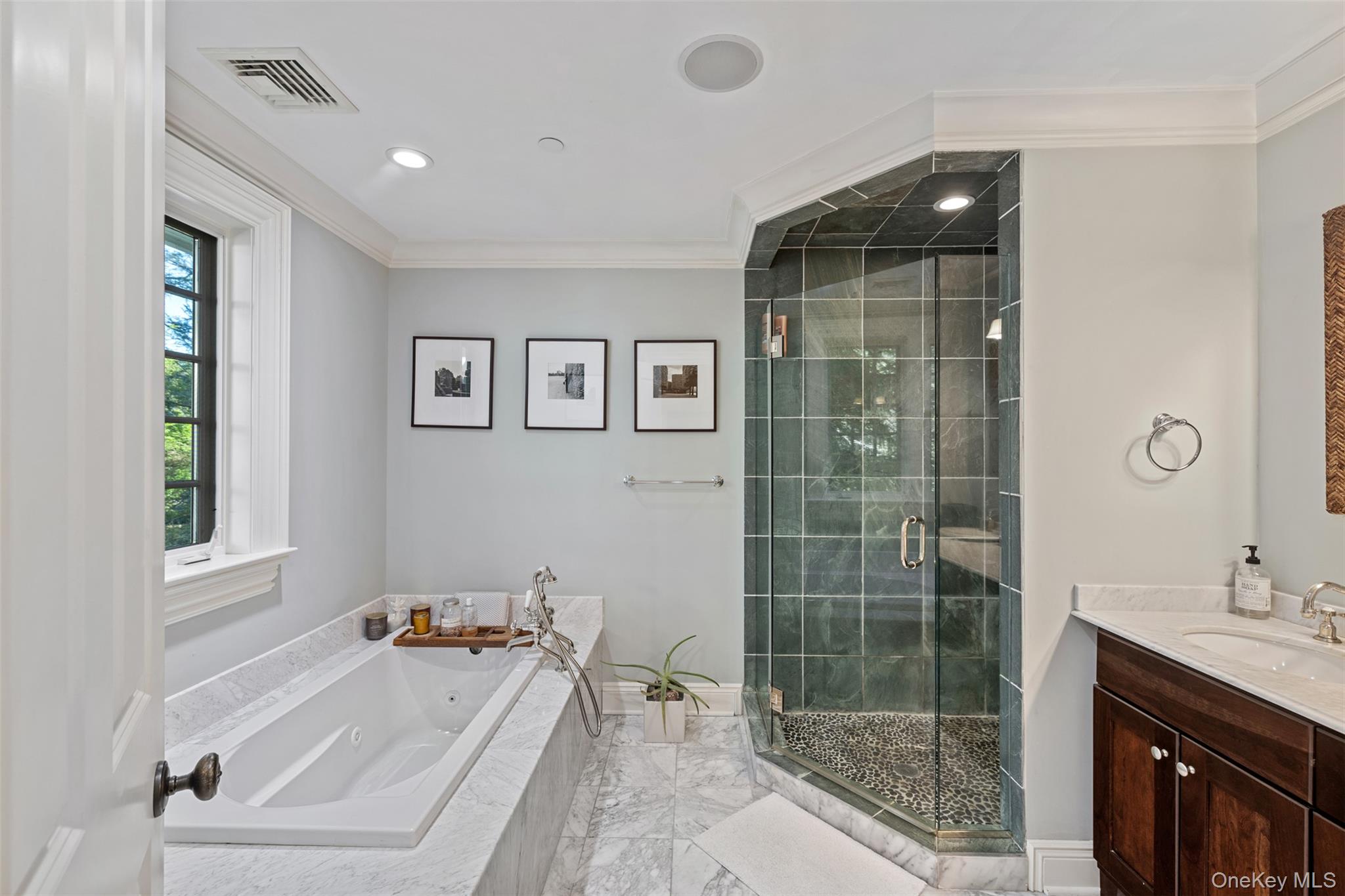 12 Bishop Park Road Pound Ridge, NY 10576 - Photo 21 of 49 a bathroom with a tub sink and shower