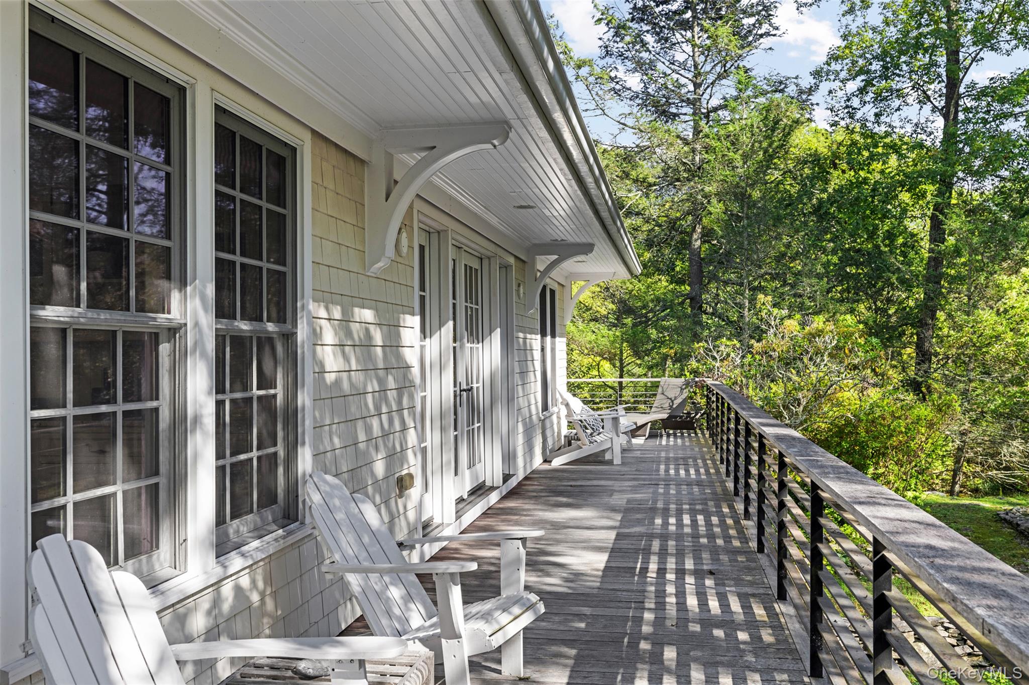 12 Bishop Park Road Pound Ridge, NY 10576 - Photo 28 of 49 a view of house with wooden floor and outdoor seating