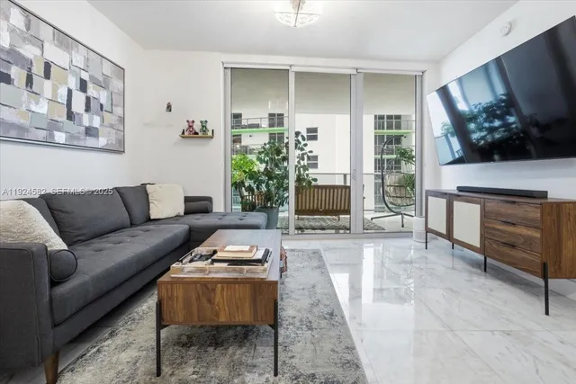a living room with furniture and a flat screen tv