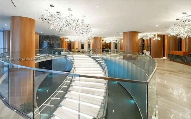 a view of a living room and chandelier