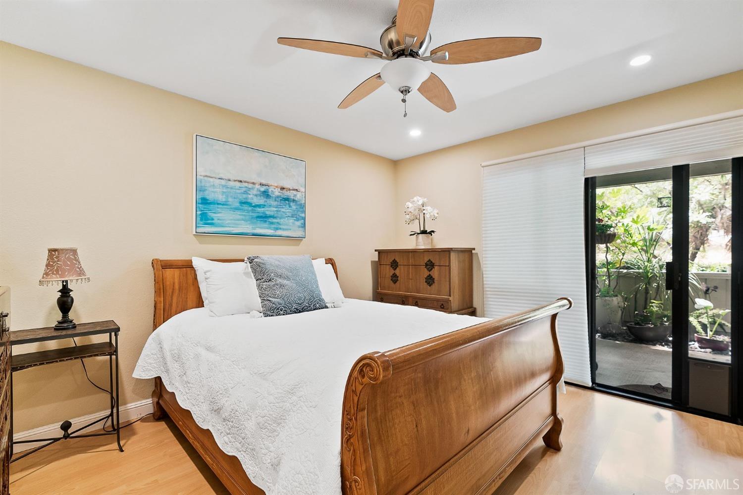 348 Mill Road Martinez, CA 94553 - Photo 11 of 28 a bedroom with a large bed and a chandelier