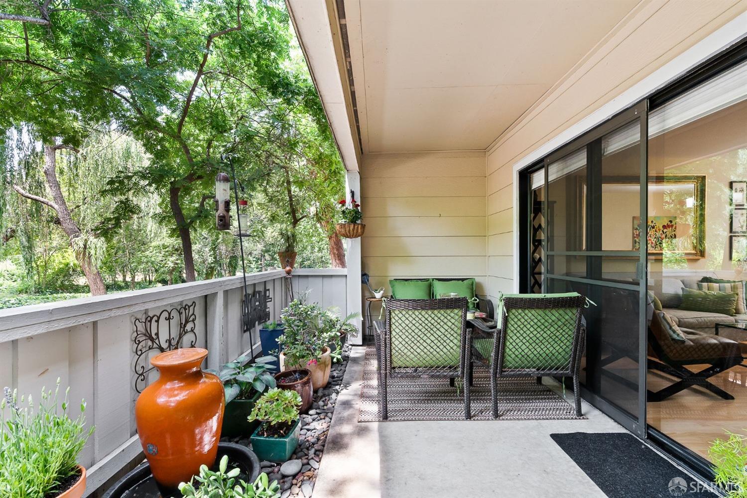 348 Mill Road Martinez, CA 94553 - Photo 18 of 28 a balcony with couple of chairs and a potted plant