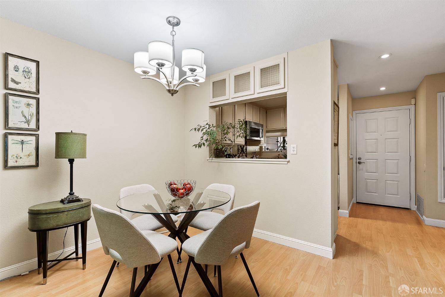 348 Mill Road Martinez, CA 94553 - Photo 4 of 28 a view of a dining room with furniture wooden floor and a chandelier