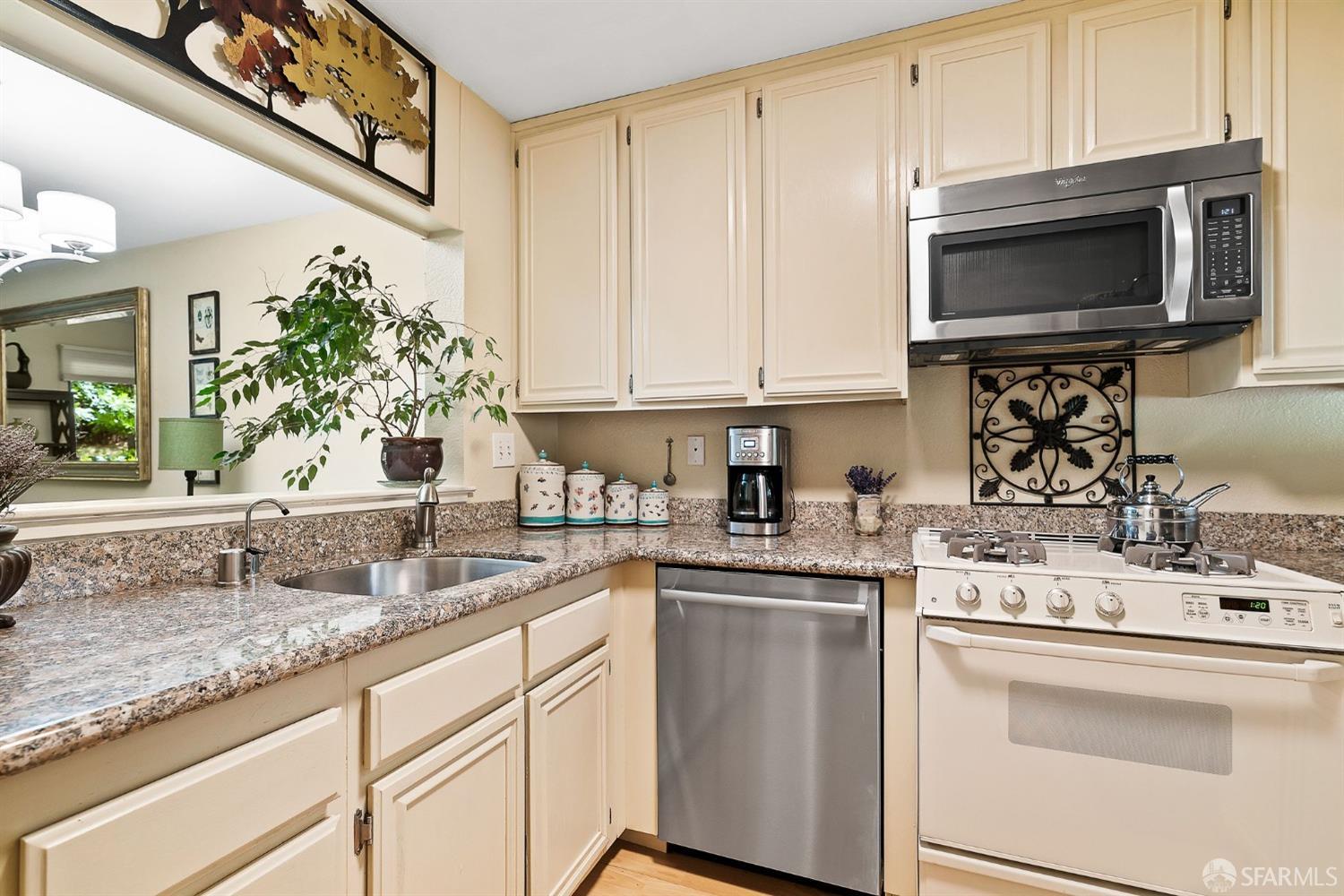 348 Mill Road Martinez, CA 94553 - Photo 6 of 28 a kitchen with a sink stove and microwave