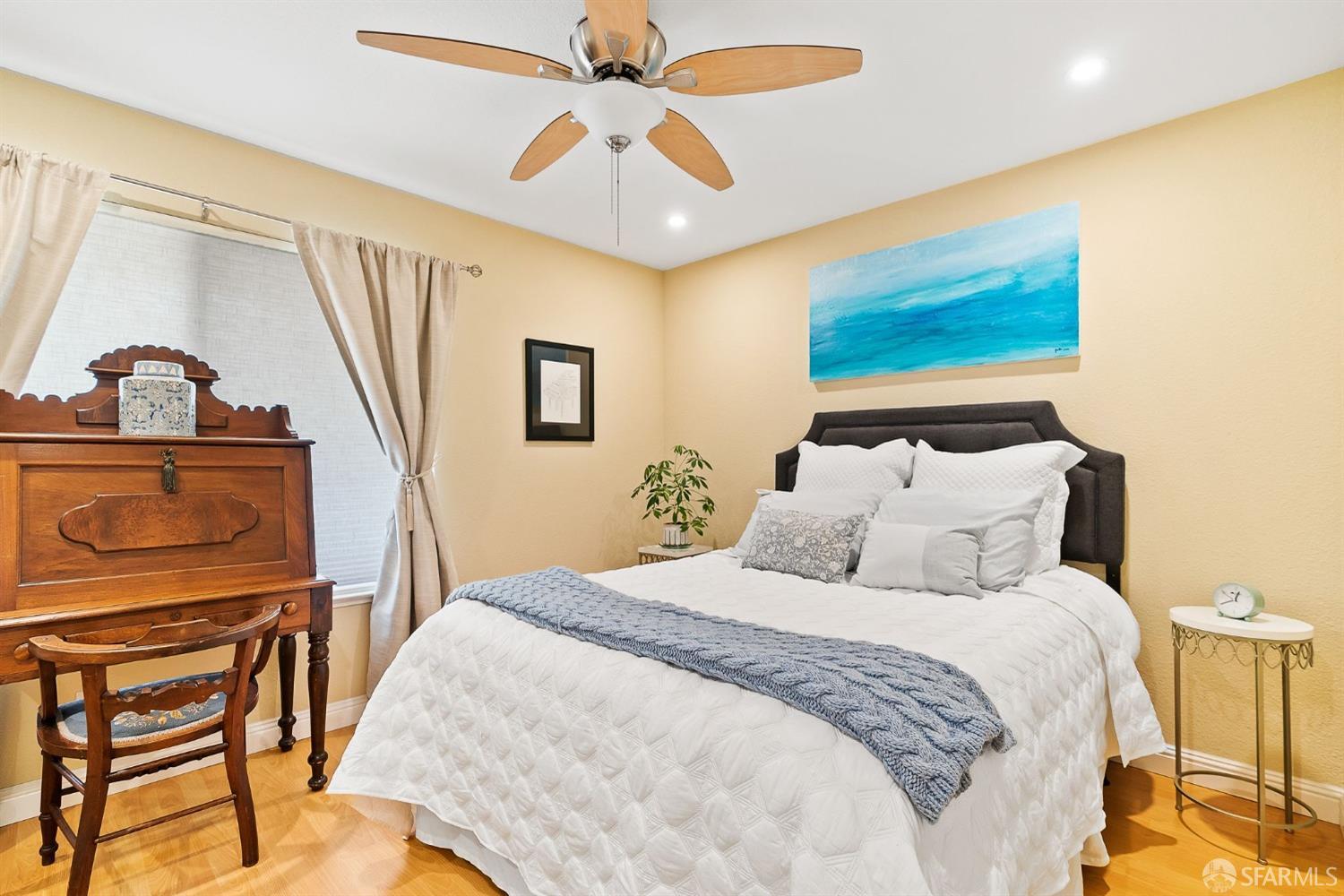 348 Mill Road Martinez, CA 94553 - Photo 9 of 28 a bedroom with bed and a chandelier