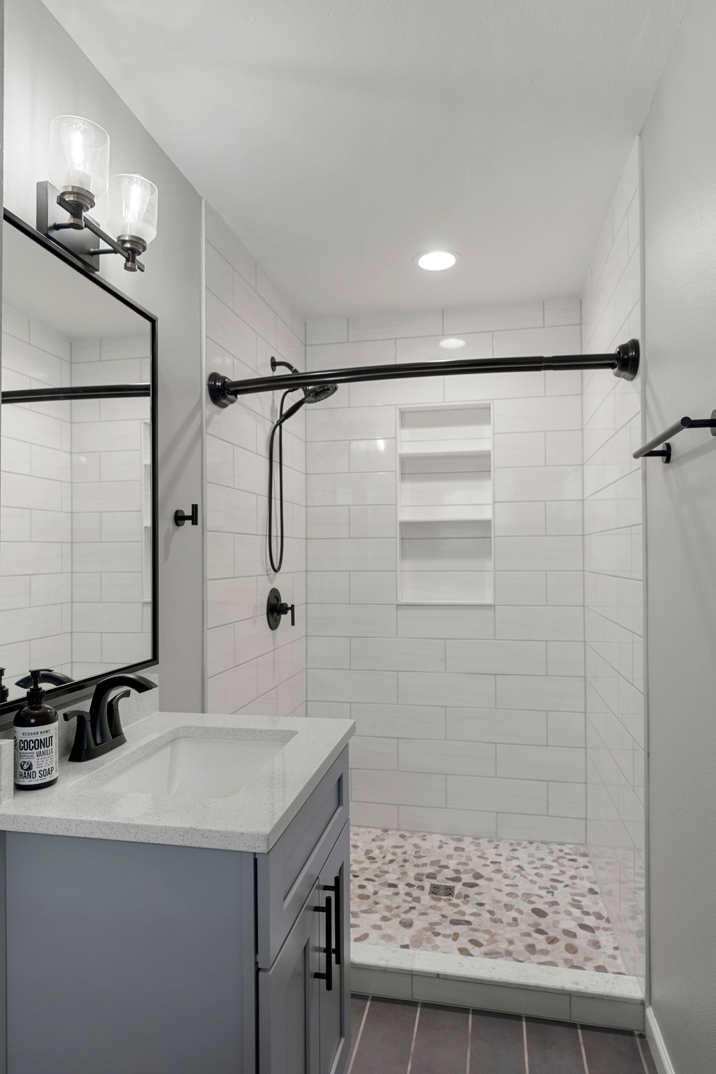 3404 Touchstone Street Austin, TX 78723 - Photo 20 of 33 Bathroom featuring vanity, a stall shower, and dark tile patterned floors