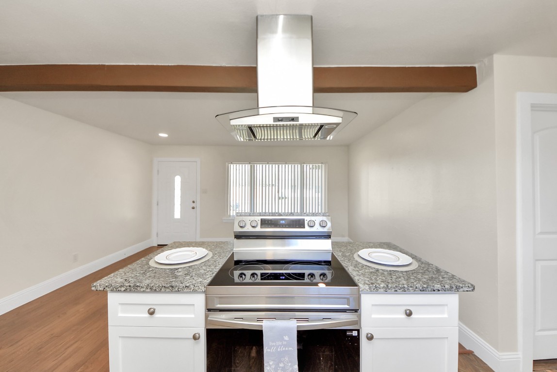 119 Burke Road Pasadena, TX 77506 - Photo 15 of 47 a stove top oven sitting inside of a kitchen