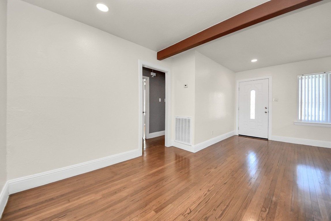 119 Burke Road Pasadena, TX 77506 - Photo 20 of 47 a view of an empty room with wooden floor