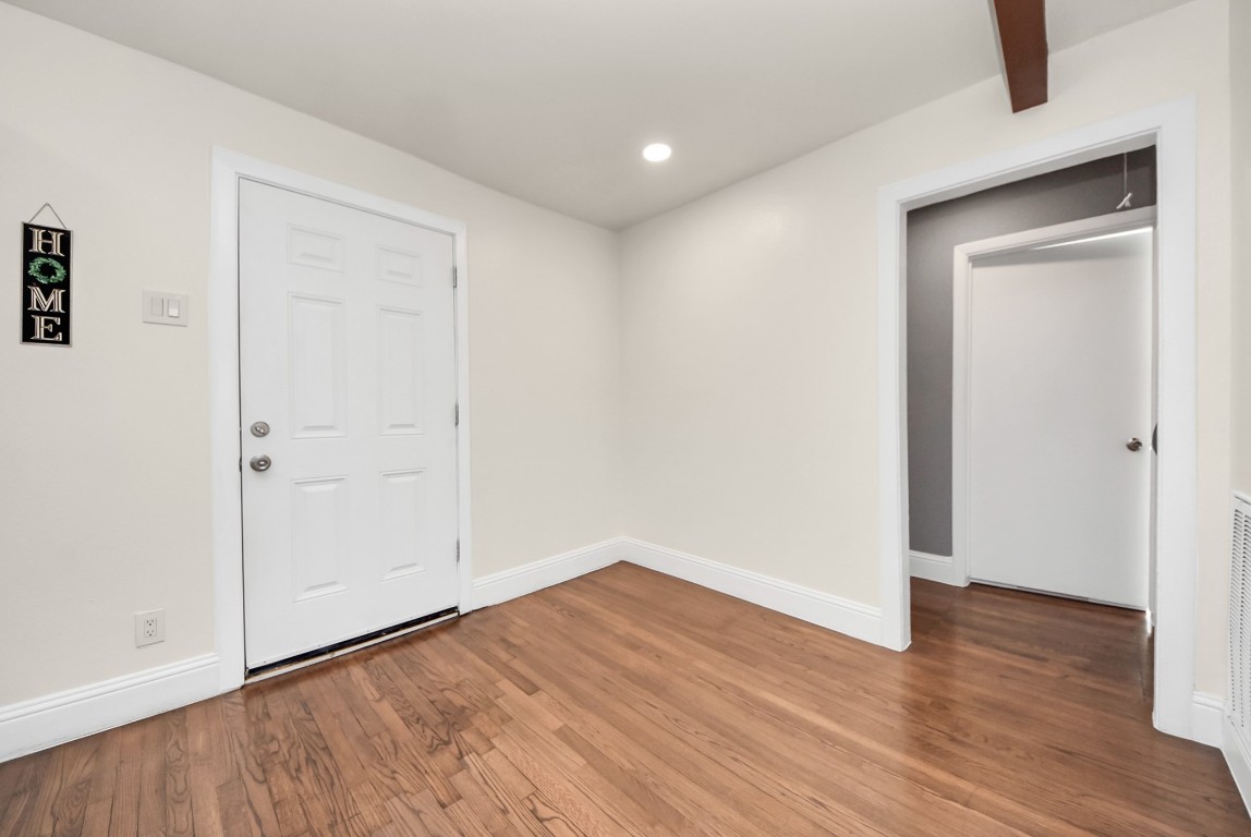 119 Burke Road Pasadena, TX 77506 - Photo 21 of 47 an empty room with wooden floor