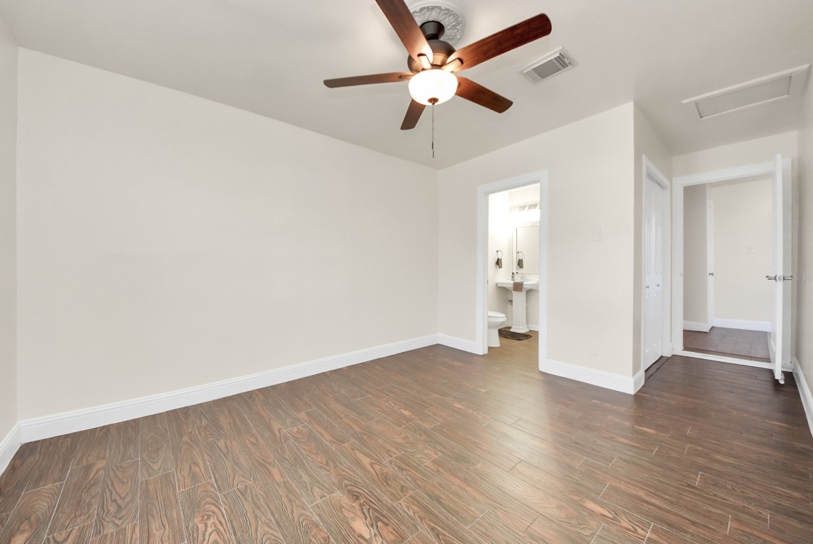 119 Burke Road Pasadena, TX 77506 - Photo 22 of 47 an empty room with wooden floor fan and a ceiling fan