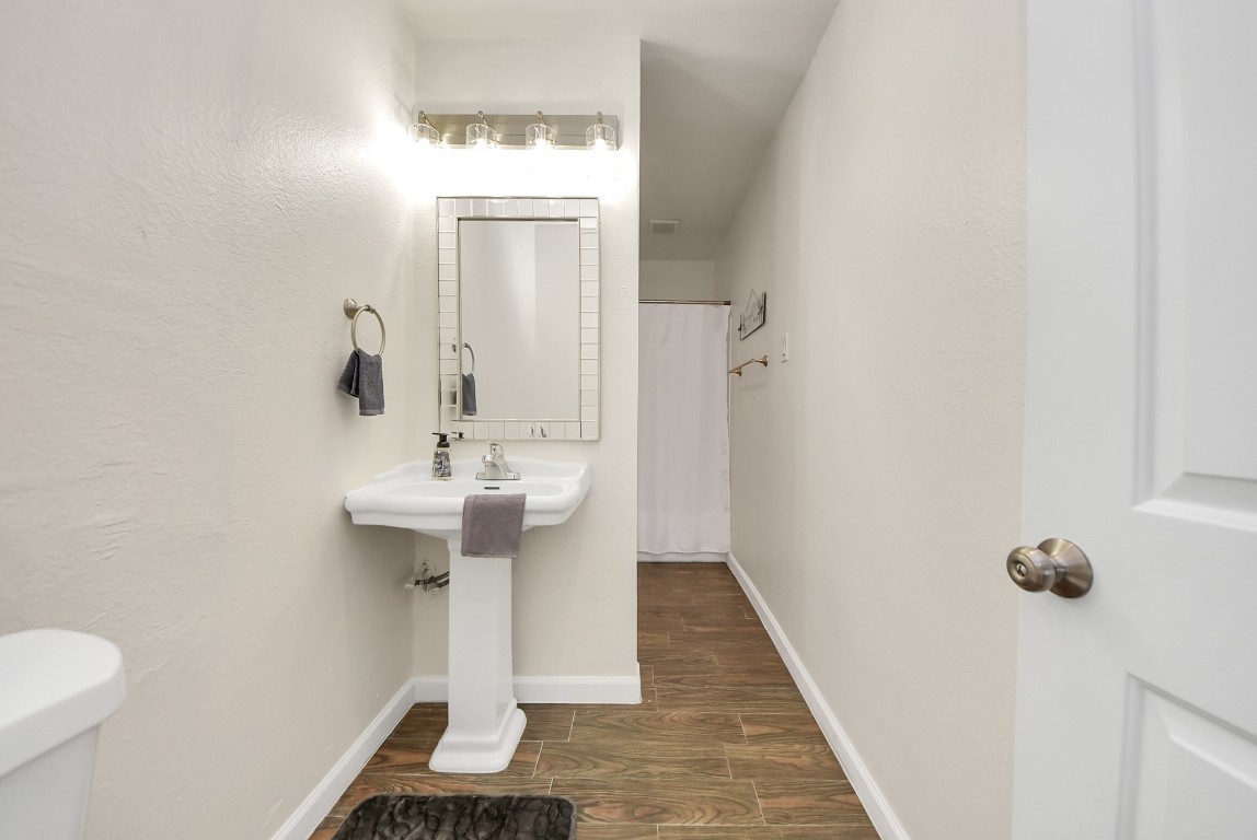 119 Burke Road Pasadena, TX 77506 - Photo 25 of 47 a bathroom with a sink and mirror