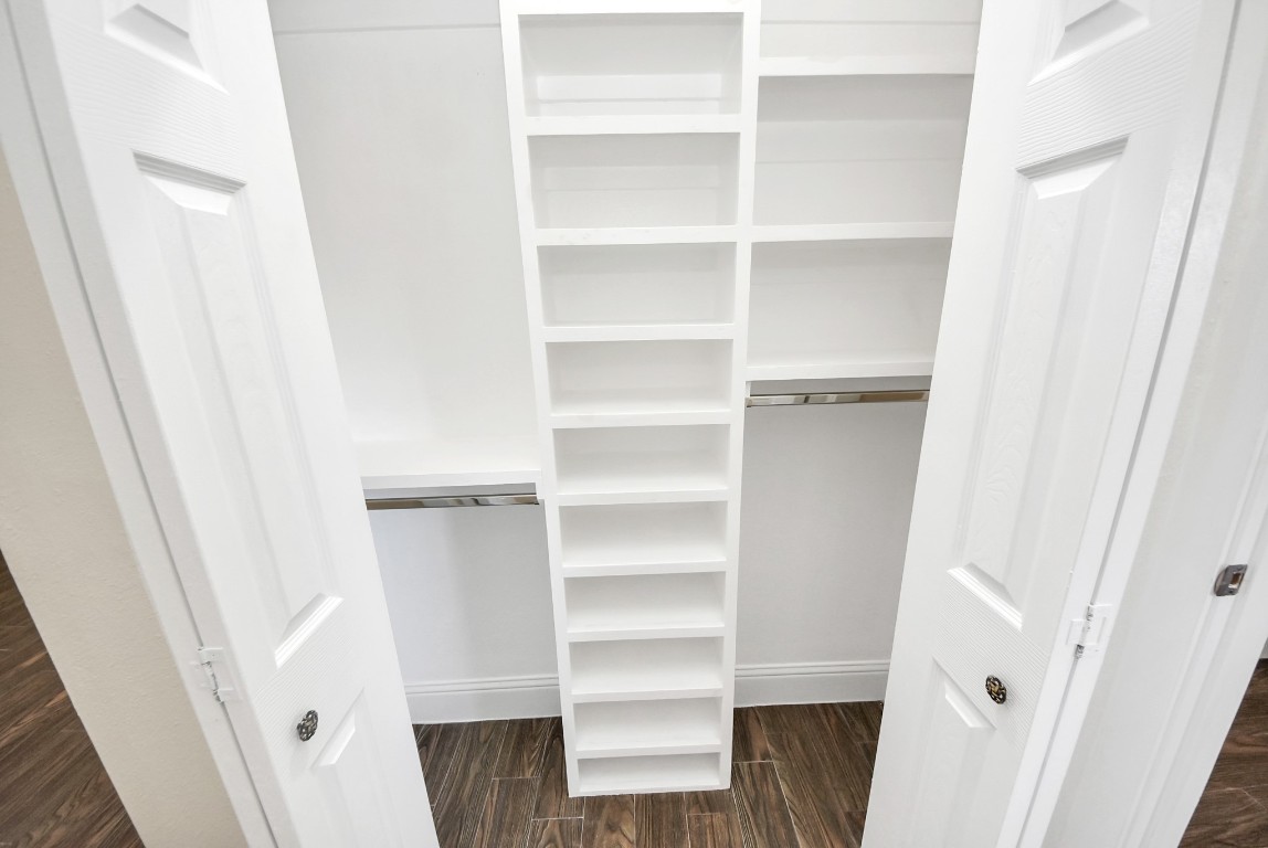 119 Burke Road Pasadena, TX 77506 - Photo 26 of 47 a view of walk in closet with empty racks