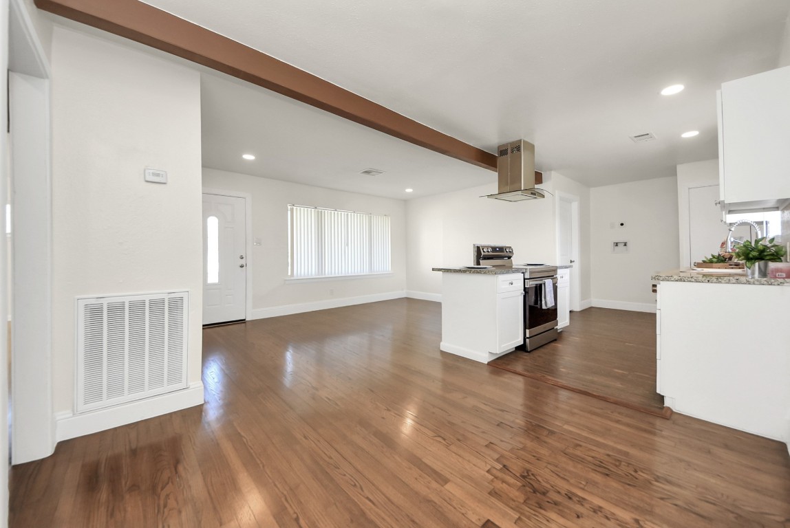 119 Burke Road Pasadena, TX 77506 - Photo 9 of 47 a kitchen with granite countertop a sink and a stove top oven