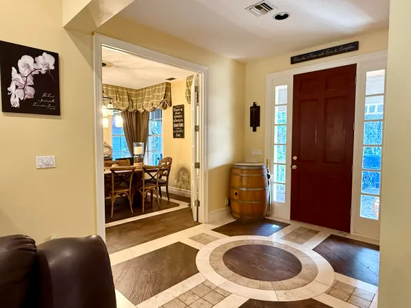 a view of a livingroom with furniture and a ceiling fan