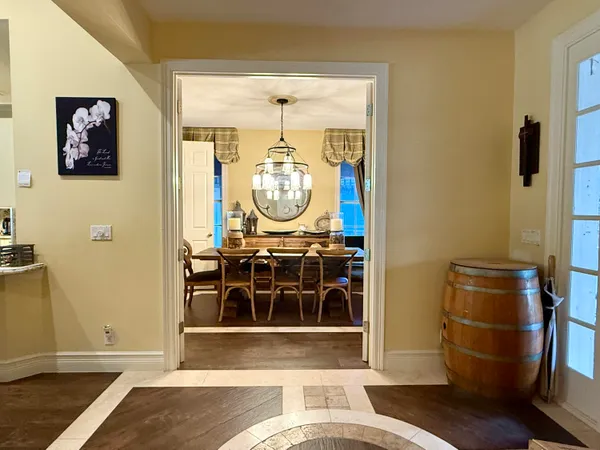a view of a swimming pool with a yard and sitting area