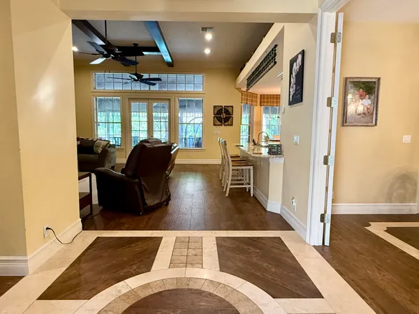 a view of a house with backyard and sitting area
