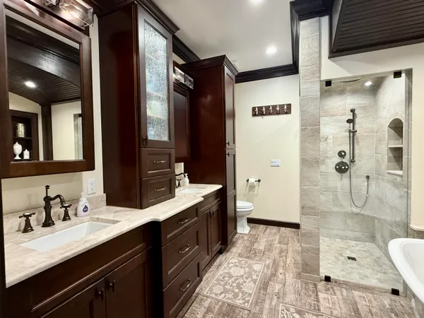 a view of a patio with a table chairs and a floor to ceiling window