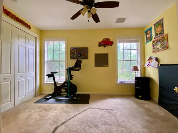 a front view of a house with a yard table and chairs