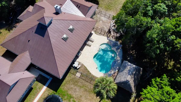 an aerial view of house with yard