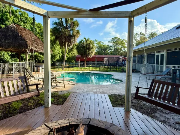 a view of a backyard with tree