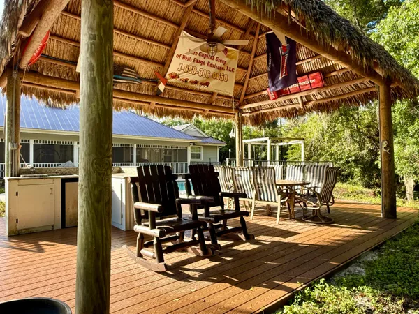 a view of a backyard with plants and patio