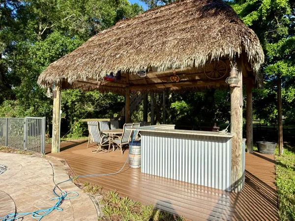 a view of a swimming pool with sitting area