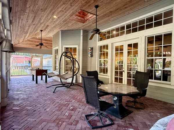 an aerial view of residential houses with outdoor space and swimming pool