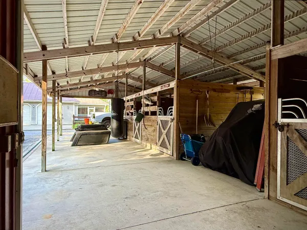 a view of walk in closet with clothes