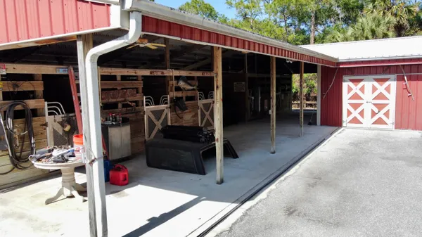 a view of a grassy field with trees