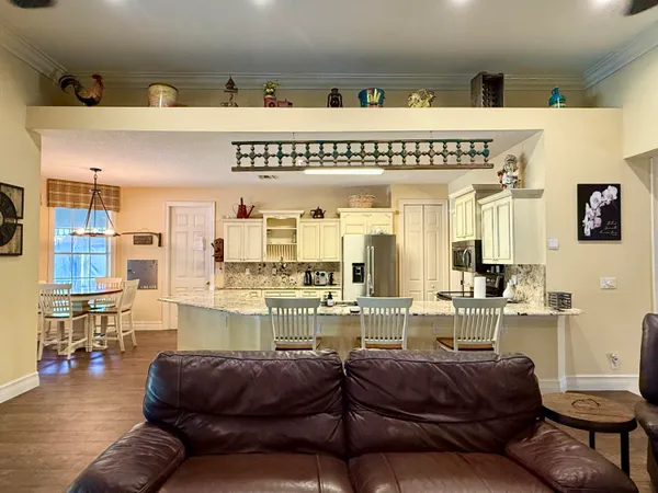 a living room with furniture fireplace and flat screen tv