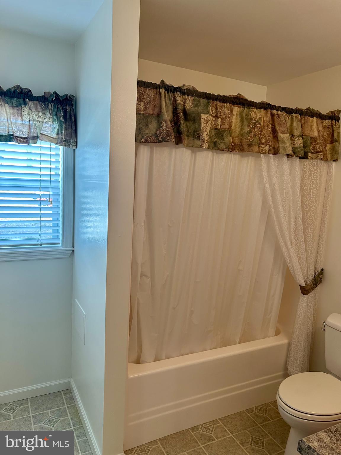 5 Reid Drive Nottingham, PA 19362 - Photo 13 of 23 a bathroom with a shower curtain and sink