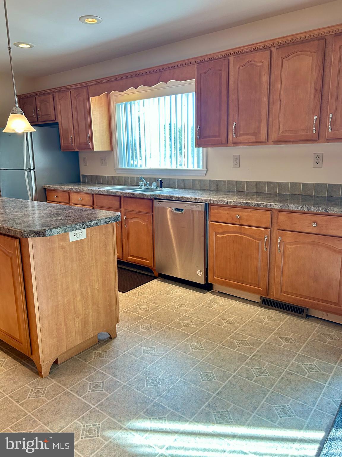 5 Reid Drive Nottingham, PA 19362 - Photo 16 of 23 a kitchen with stainless steel appliances granite countertop a stove a sink and a microwave
