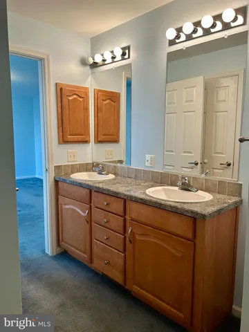a bathroom with a glass door shower
