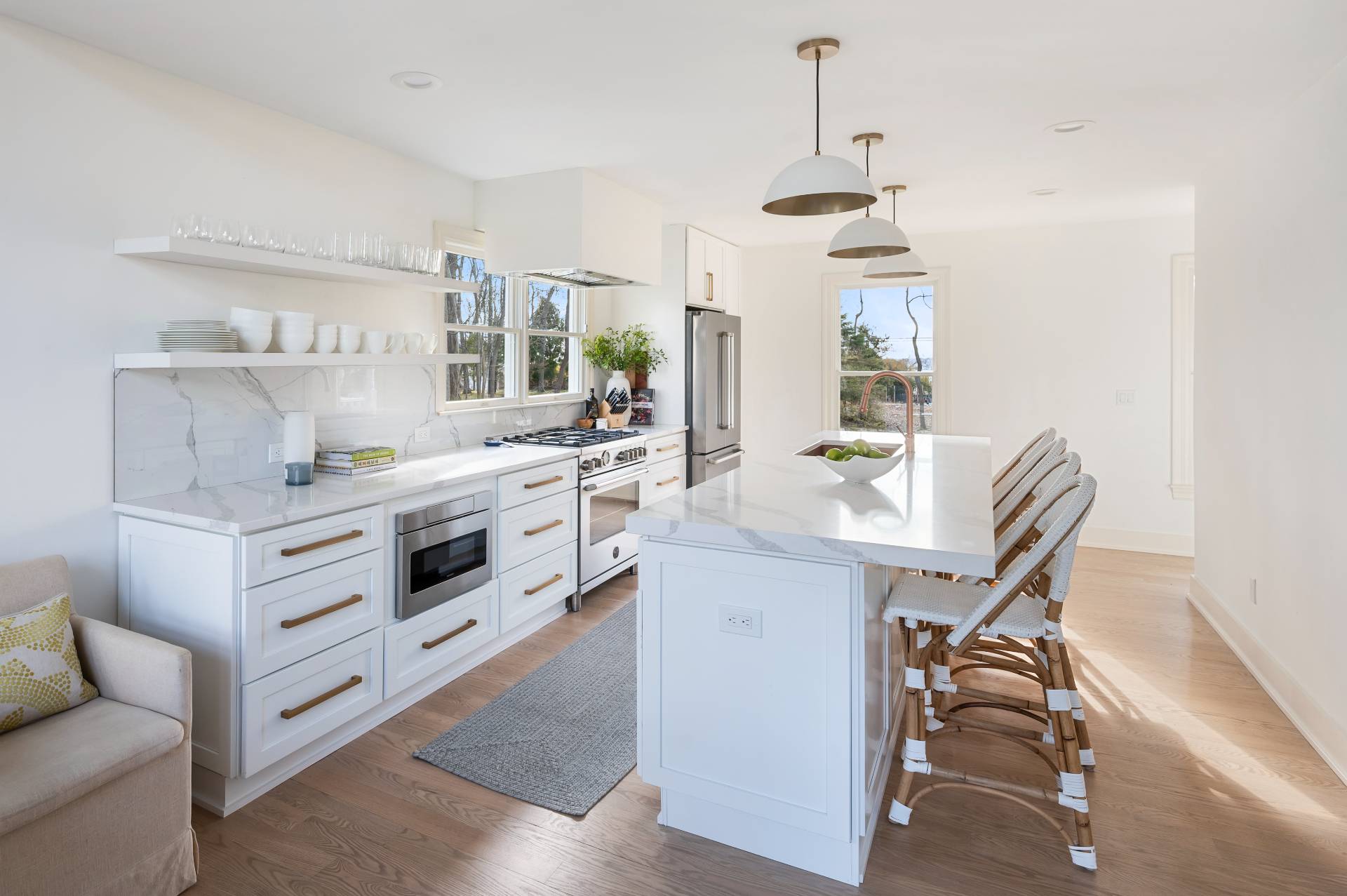40 Dinah Rock Road Shelter Island, NY 11964 - Photo 13 of 29 a kitchen with a white stove top oven and furniture