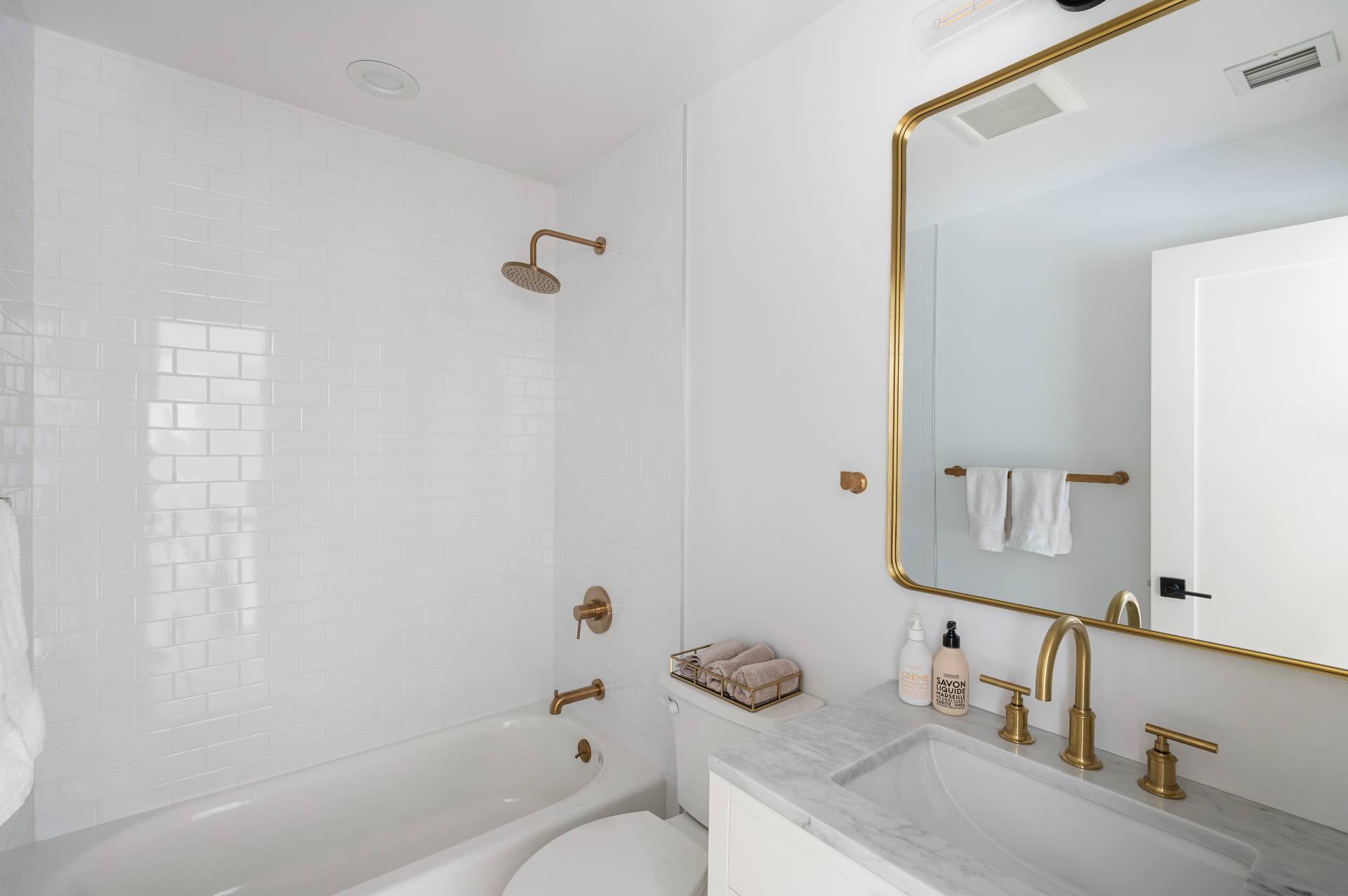 40 Dinah Rock Road Shelter Island, NY 11964 - Photo 24 of 29 a bathroom with a granite countertop sink toilet and shower