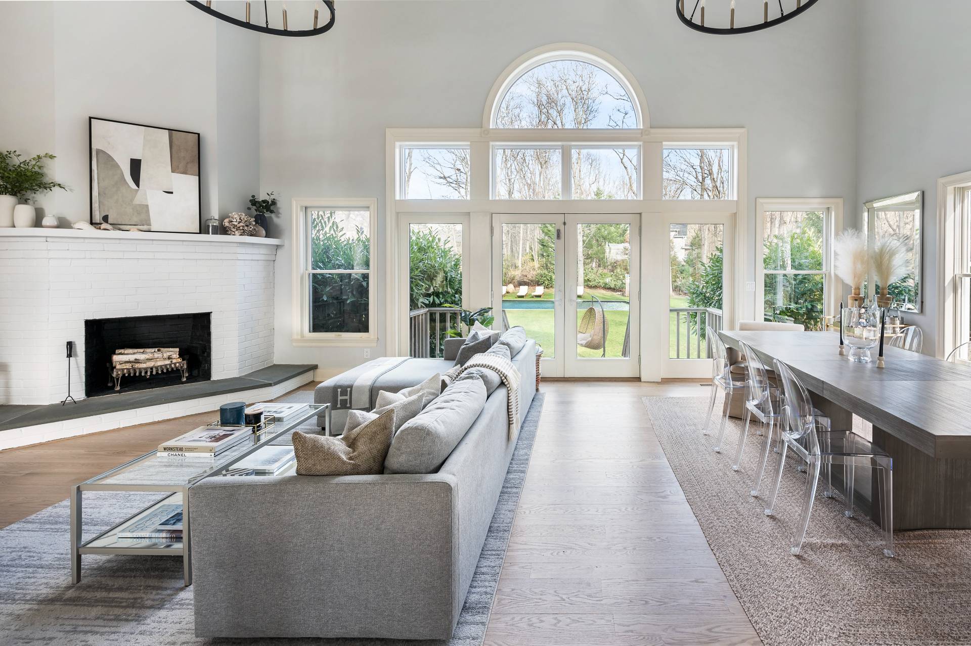 40 Dinah Rock Road Shelter Island, NY 11964 - Photo 8 of 29 a living room with furniture a fireplace and a large window