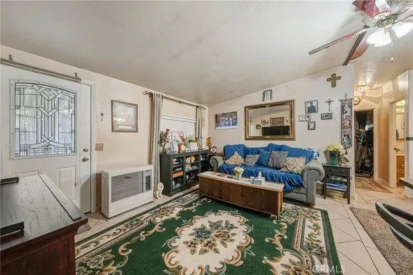 a living room with furniture and a rug