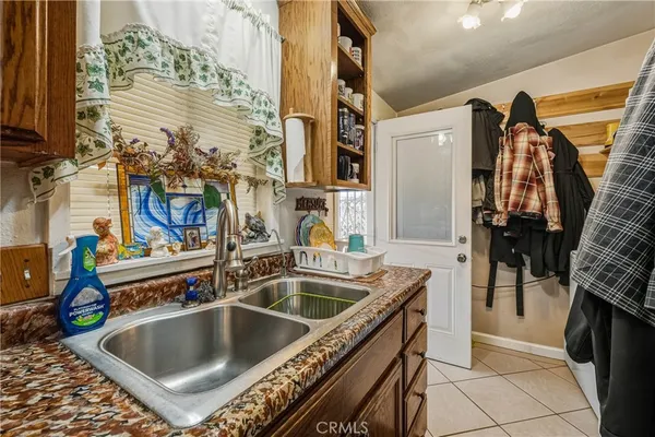 a kitchen with a sink and a refrigerator