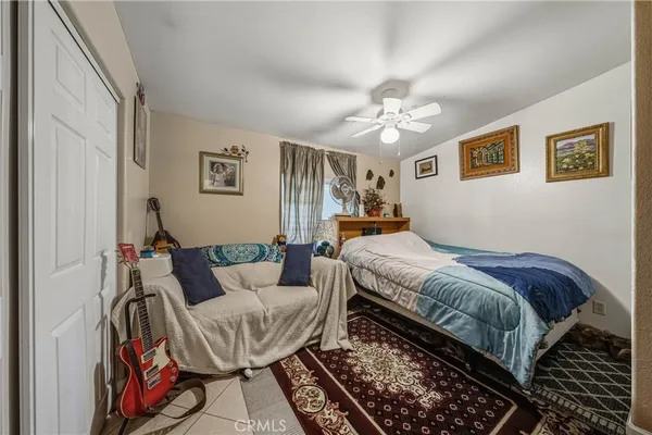 a bed room with a bed and a chandelier