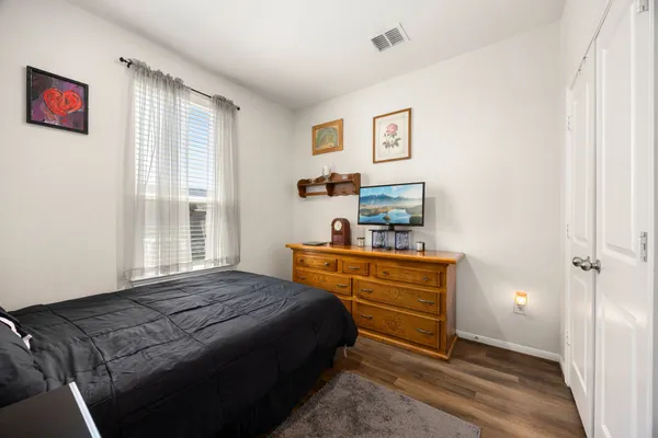 a bedroom with a bed and furniture