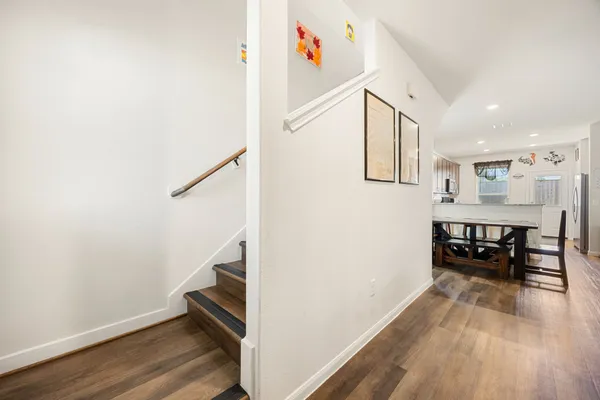 a view of dining room with furniture and wooden floor